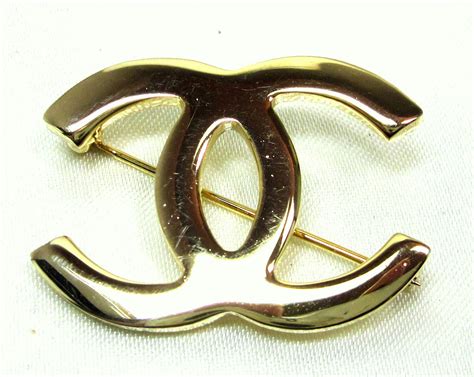 chanel cc brooch replica|knock off Chanel brooch.